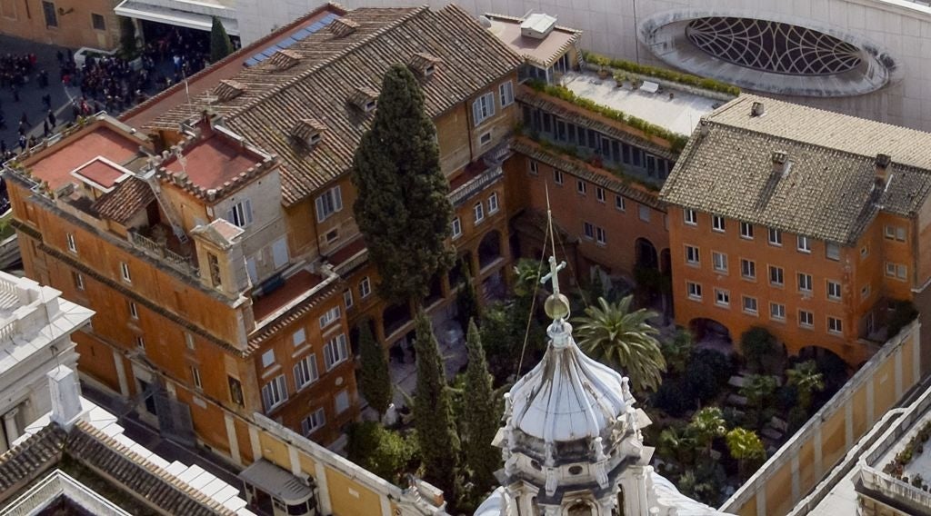 Aerial presumption    of a historical  gathering  analyzable  with a courtyard plot  featuring gangly  trees and surrounded by ceramic  structures