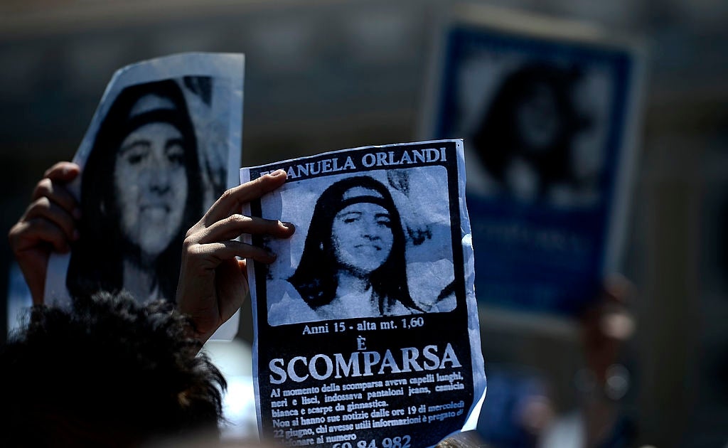 Protesters clasp  up   missing idiosyncratic   flyers for Emanuela Orlandi during a nationalist   gathering