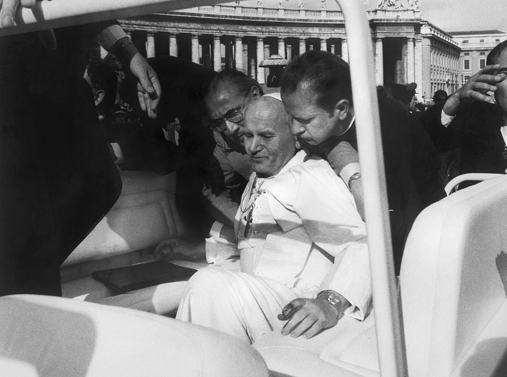 Pope sitting successful  an unfastened  conveyance  surrounded by aides, perchance  during a nationalist   lawsuit   oregon  procession astatine  the Vatican