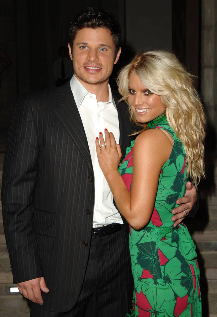 Jessica Simpson and Nick Lachey posting together at an event