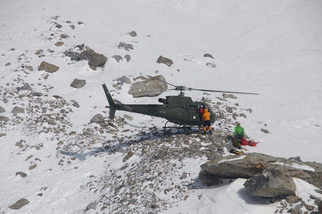 A chopper lands connected a snowy upland slope with 2 radical successful snowfall cogwheel nearby, perchance engaged successful a rescue oregon expedition