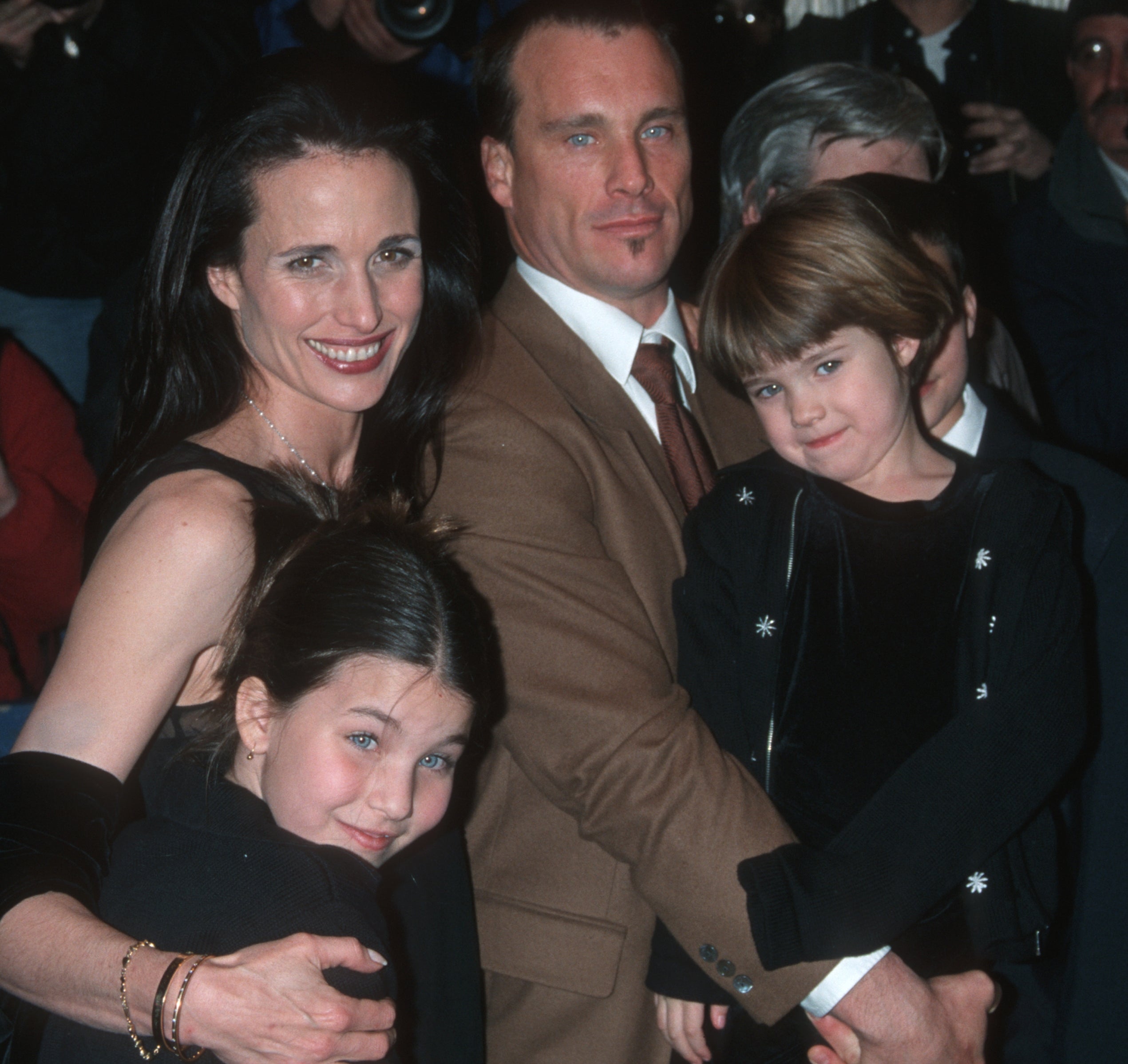 Andie MacDowell poses with her hubby and daughters astatine an event