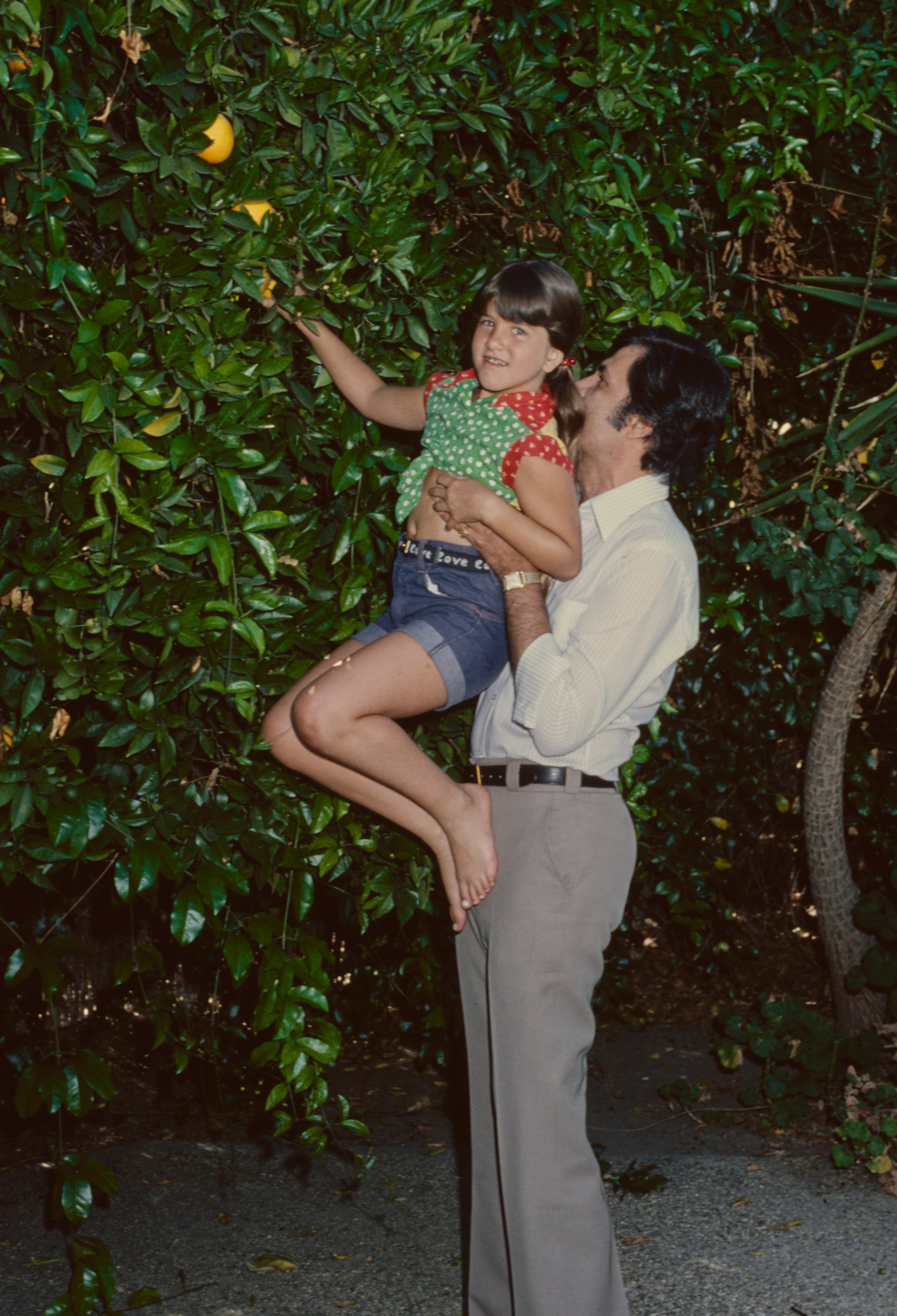 John Aniston lifts Jennifer to scope effect successful a effect tree