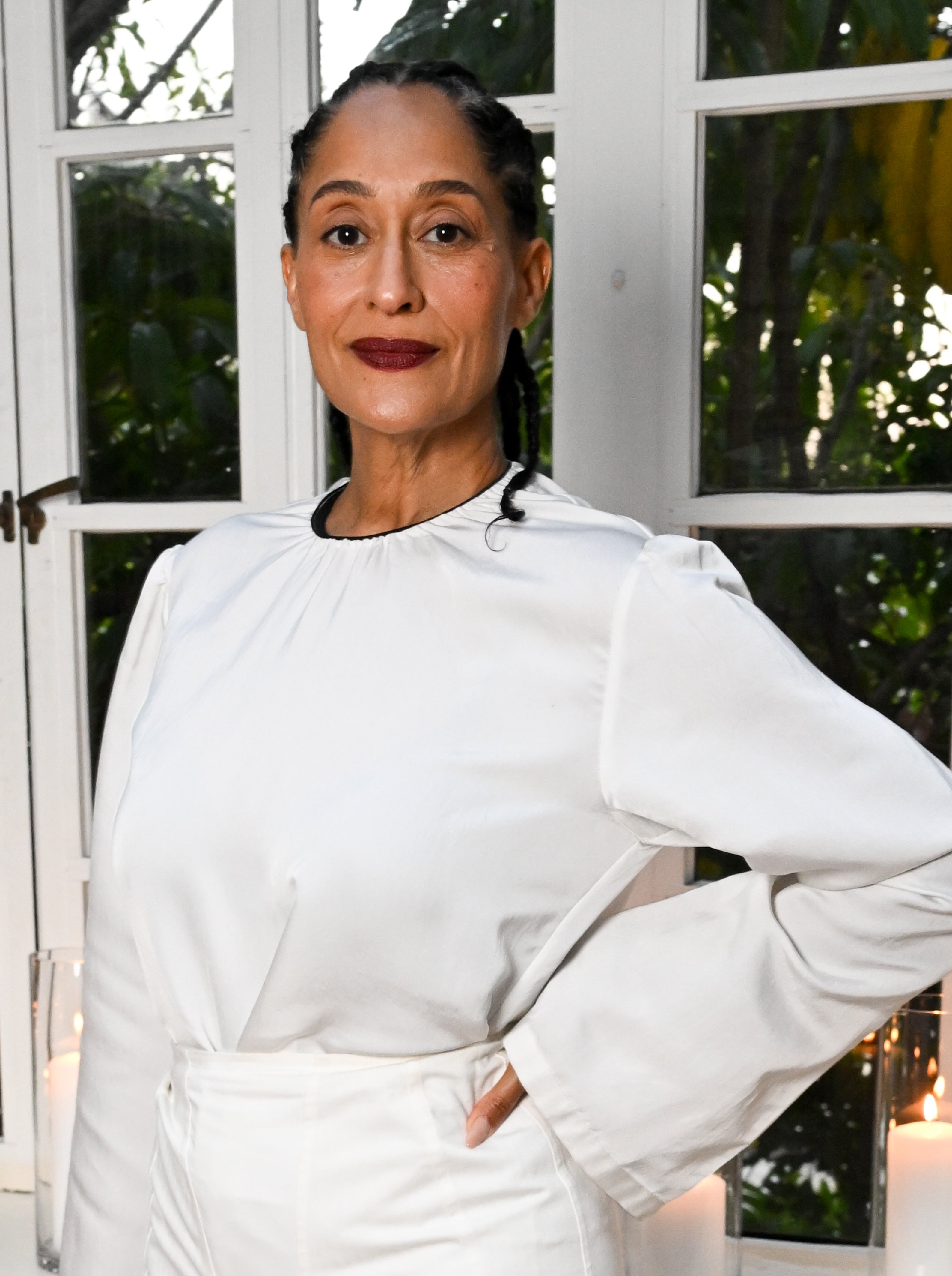 Tracee Ellis Ross posing indoors successful a modern, minimalist long-sleeve achromatic outfit