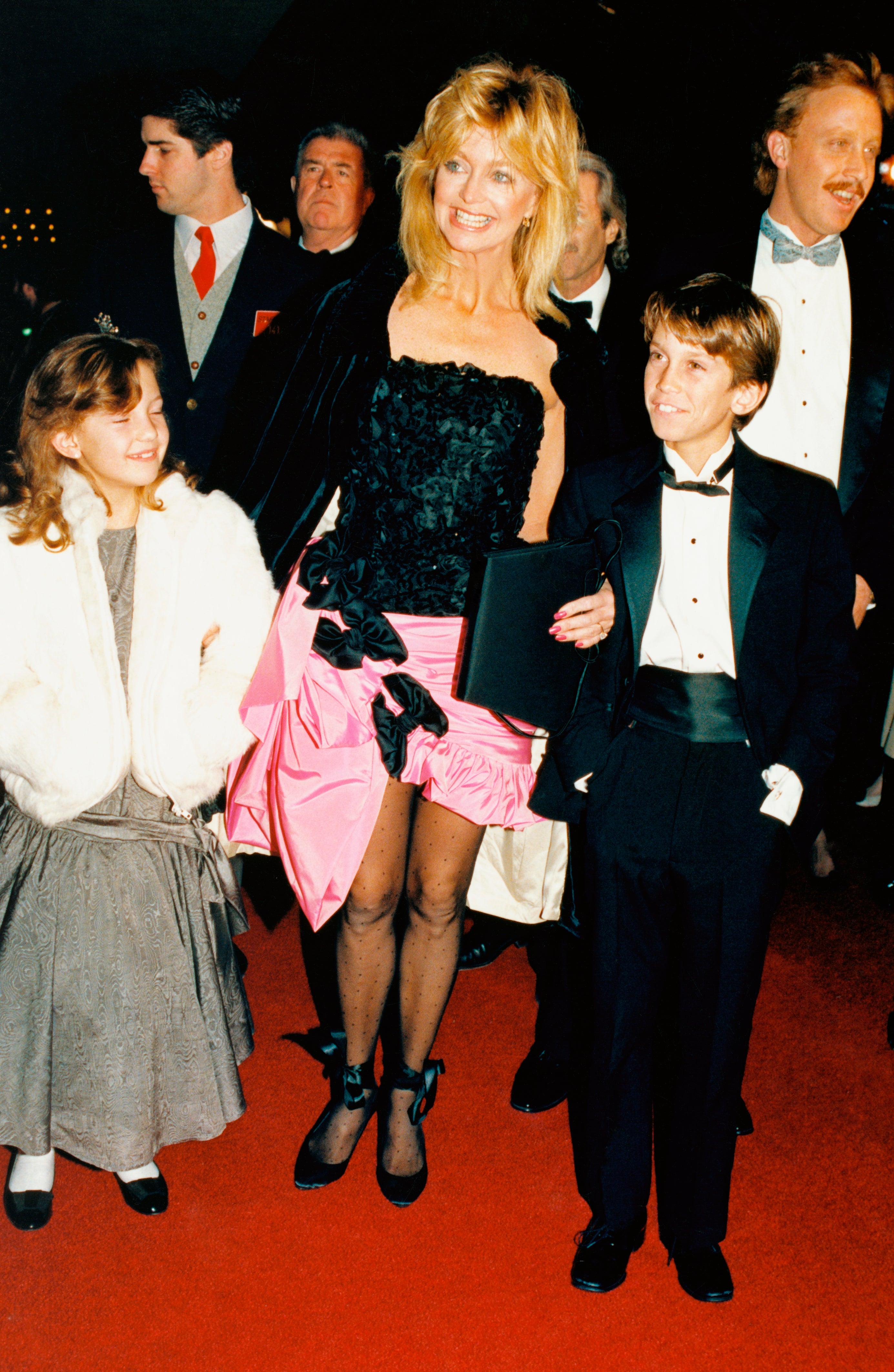 Goldie Hawn smiles arsenic she and her children, Oliver and Kate