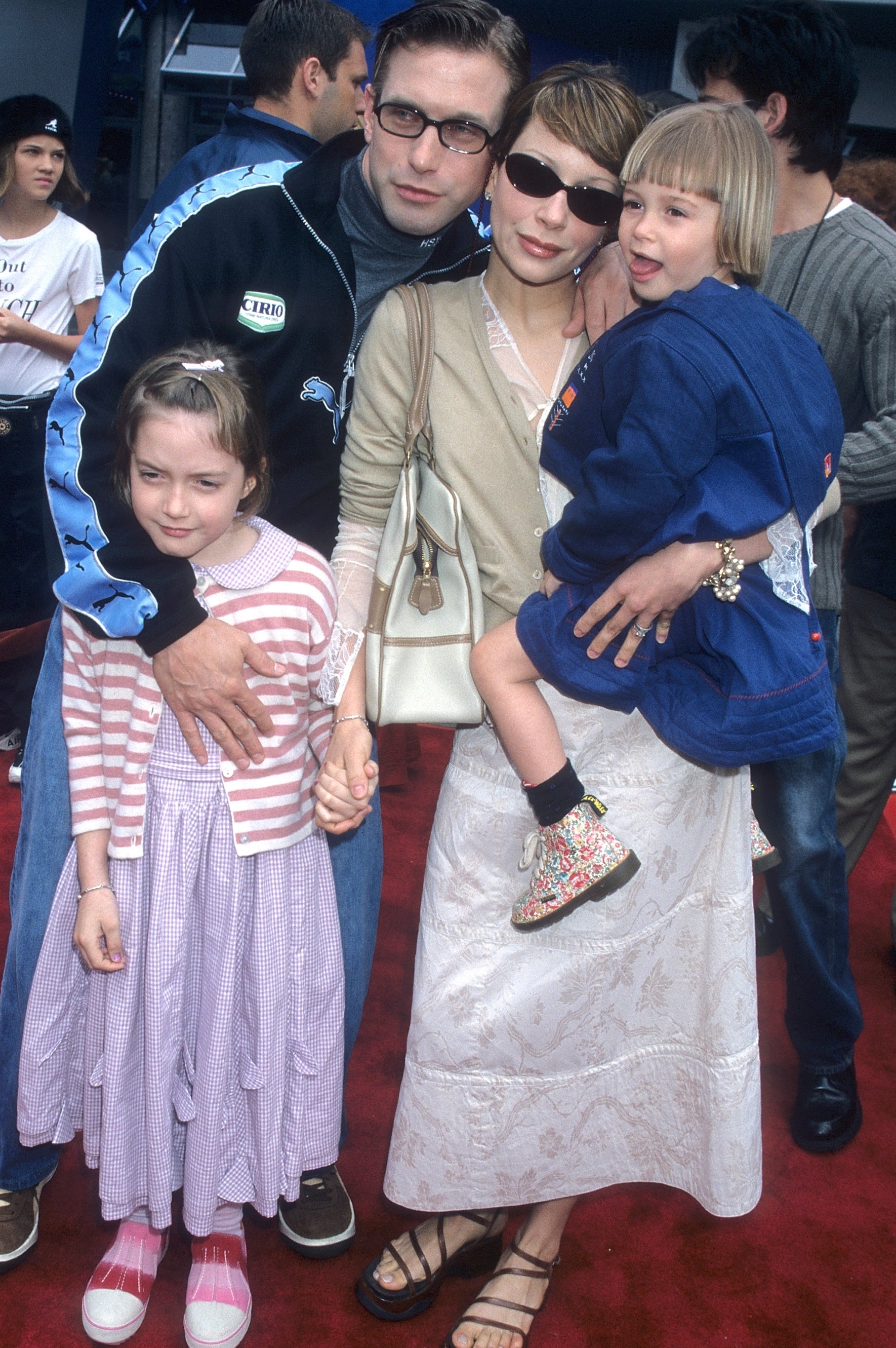 Stephen Baldwin with his household connected a reddish carpet