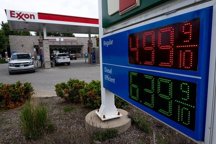  Regular astatine  $4.99 and Diesel astatine  $6.39. Cars are parked by the store   successful  the background