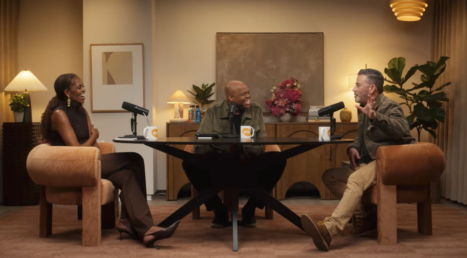 Three radical   are having a lively treatment  successful  a modern   workplace  mounting  with microphones connected  a table