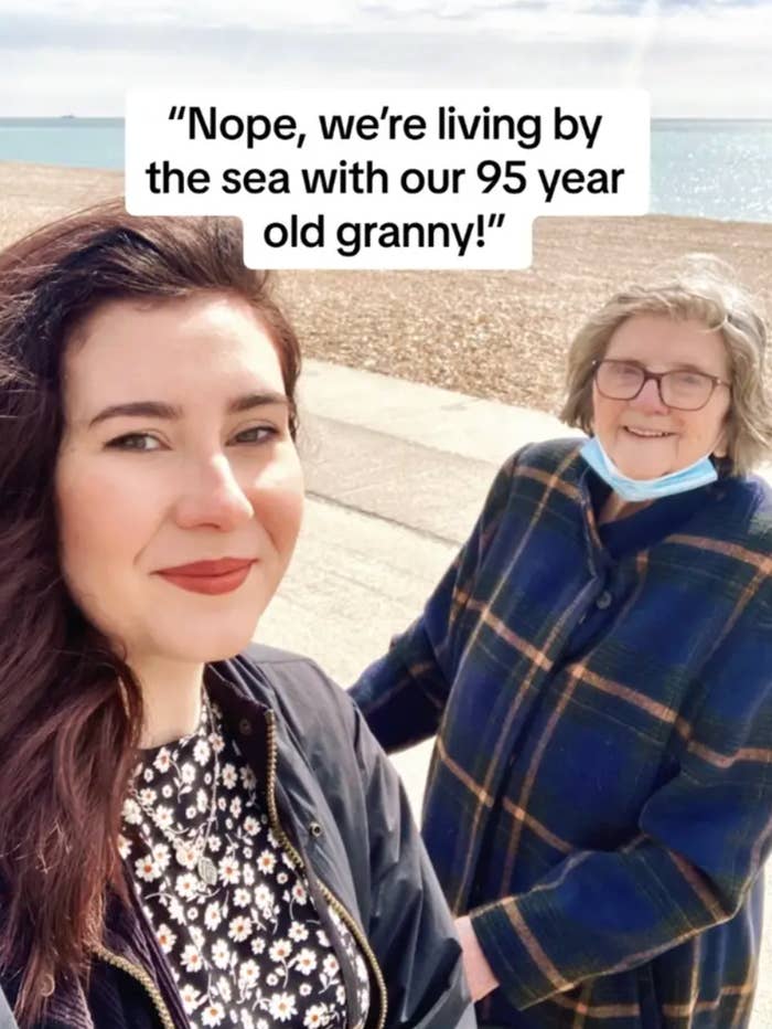 Two women smiling by the seaside with substance   saying they are surviving  with their 95-year-old grandmother