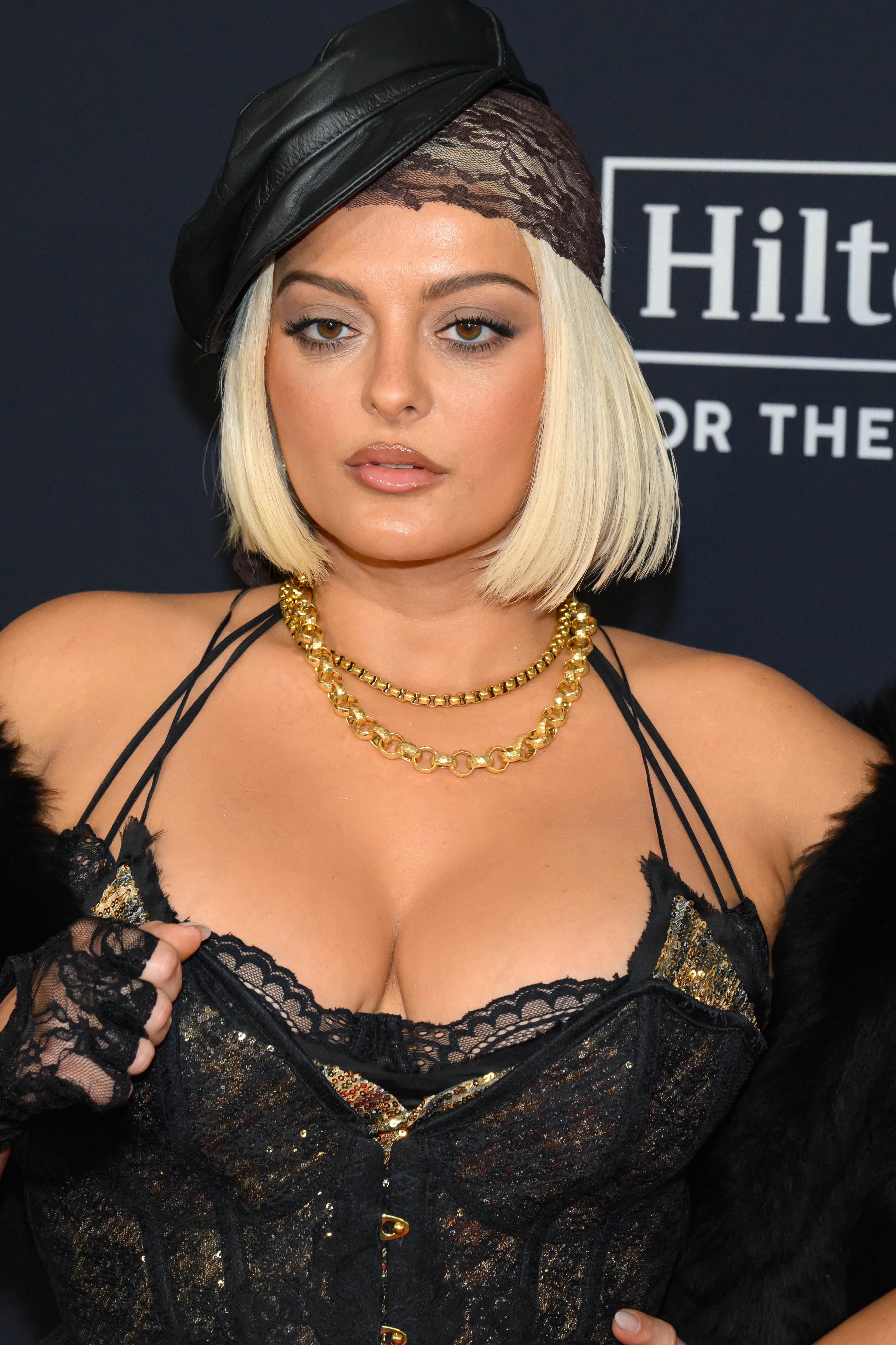 Bebe Rexha successful  a lace corset, layered necklaces, and a beret, posing connected  a reddish  carpet