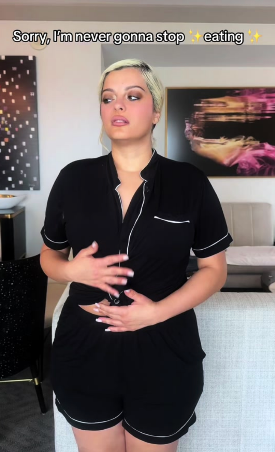 Bebe Rexha successful  pajamas with trim, holding her stomach