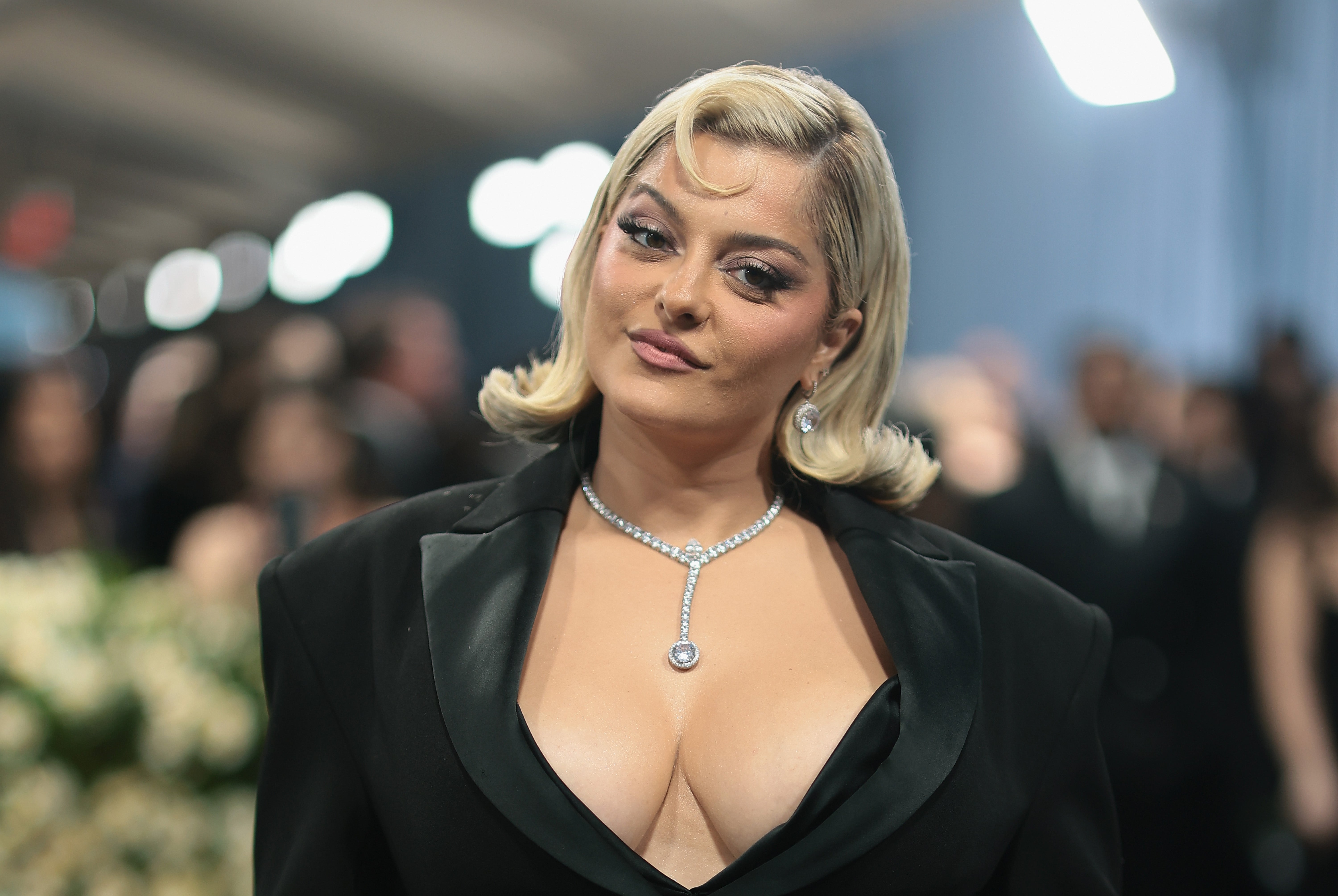 Bebe Rexha successful  elegant outfit with plunging neckline and diamond necklace poses astatine  a glamorous event