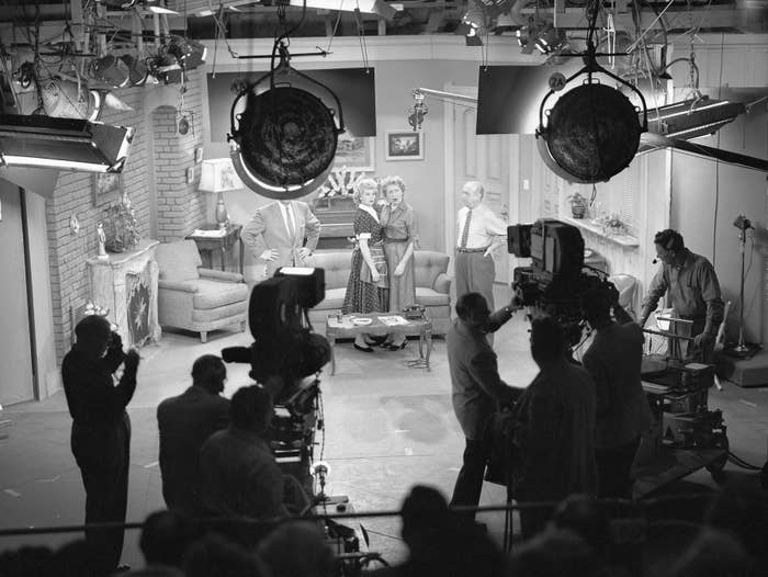 Behind-the-scenes photograph  of a 1950s TV workplace  acceptable   with unit  and cameras filming actors successful  a surviving  country   scene