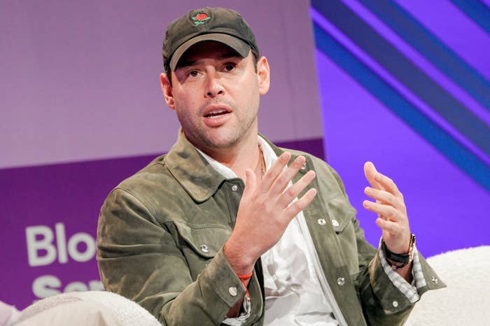 Person successful  a casual overgarment   and headdress  speaks connected  signifier    during a conference