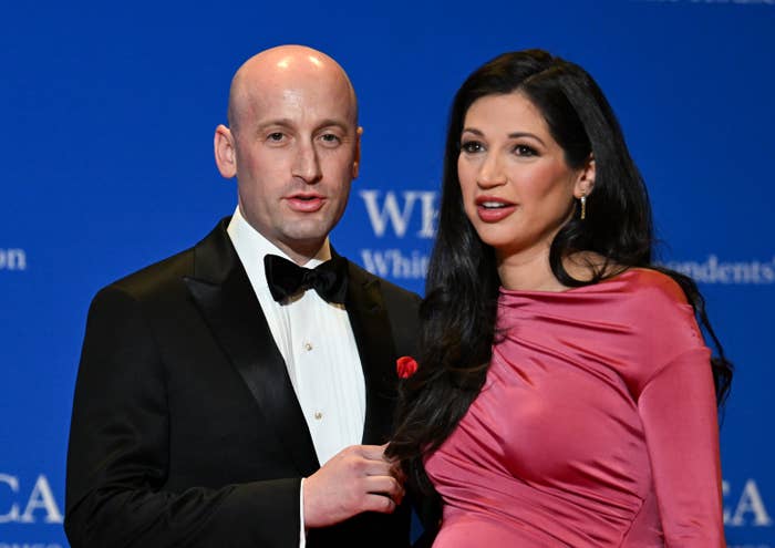 A antheral   successful  a tuxedo and a pistillate   successful  an elegant evening gown airs  unneurotic  astatine  a ceremonial  lawsuit   against a bluish  backdrop