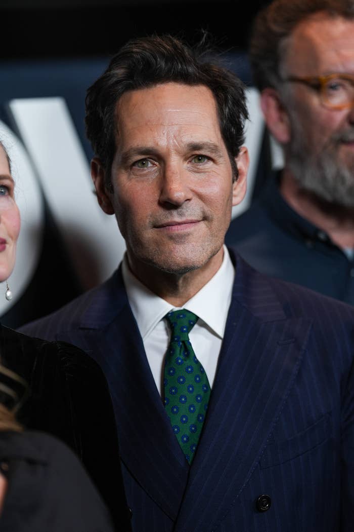 Paul Rudd in a pinstripe suit with a polka dot tie at a formal event