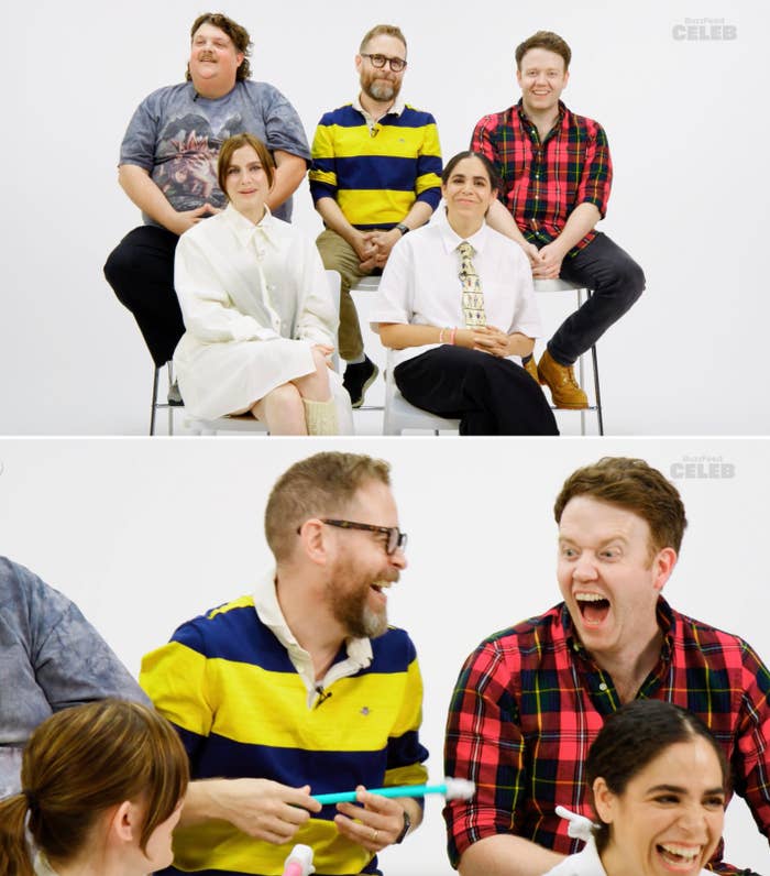 Group of five people in casual clothing sitting and laughing during an interview