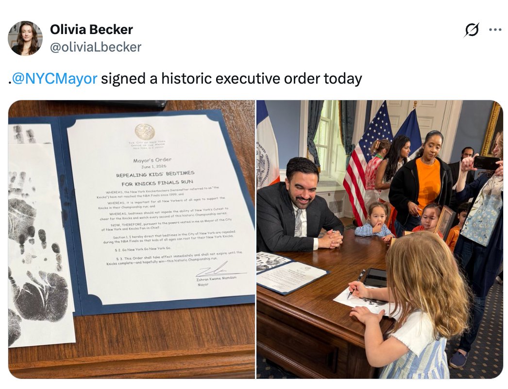 NYC Mayor signs enforcement  bid   portion    a young miss  watches closely. Document details initiatives for kids. People observe   the signing event