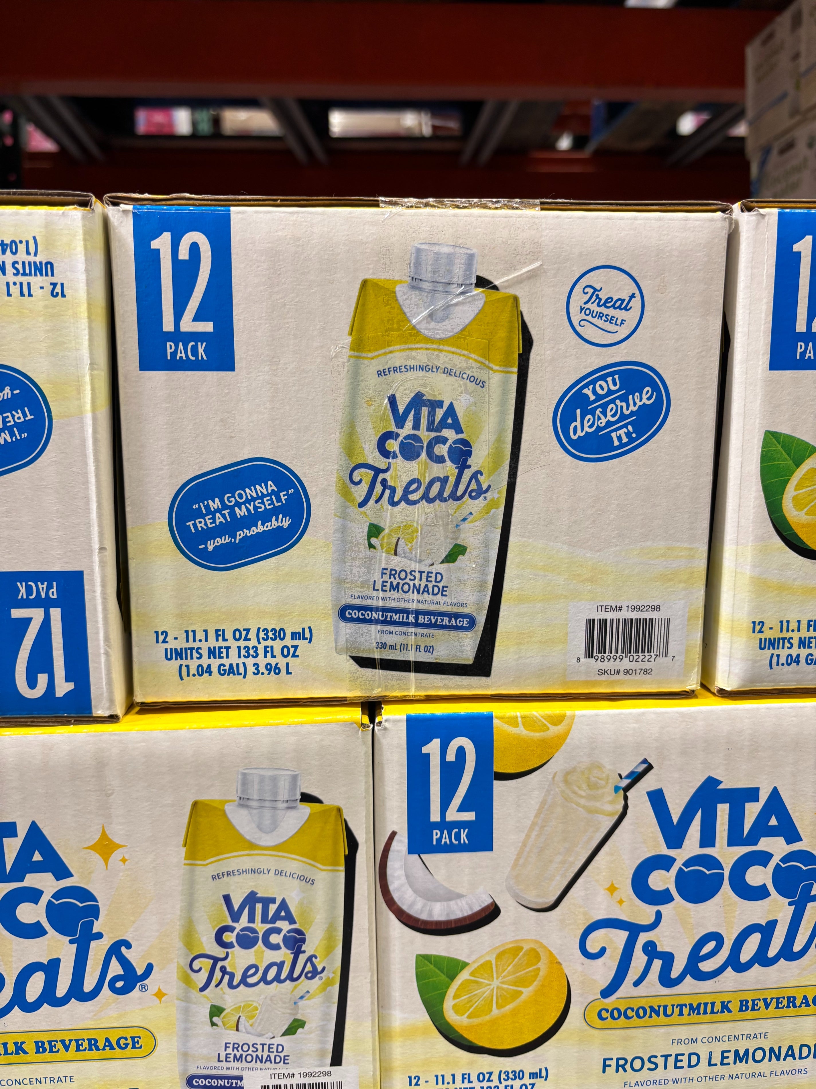 Vita Coco Treats Frosted Lemonade packaging, 12-pack of coconut milk beverages, features beverage image and slogans like "You deserve it!"