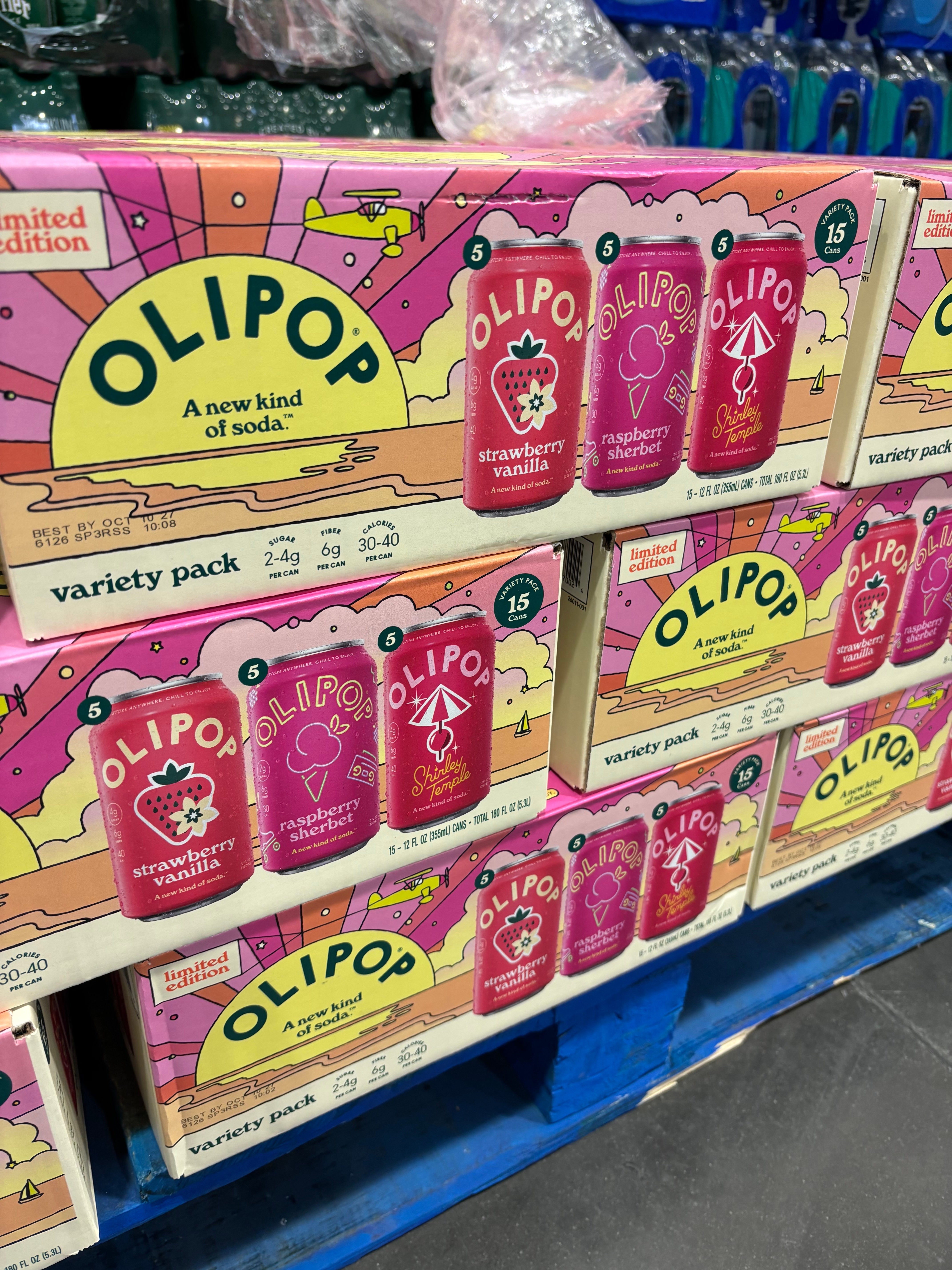 Olipop soda display showing variety packs with flavors like strawberry vanilla and raspberry. The packaging is colorful and arranged on a store shelf