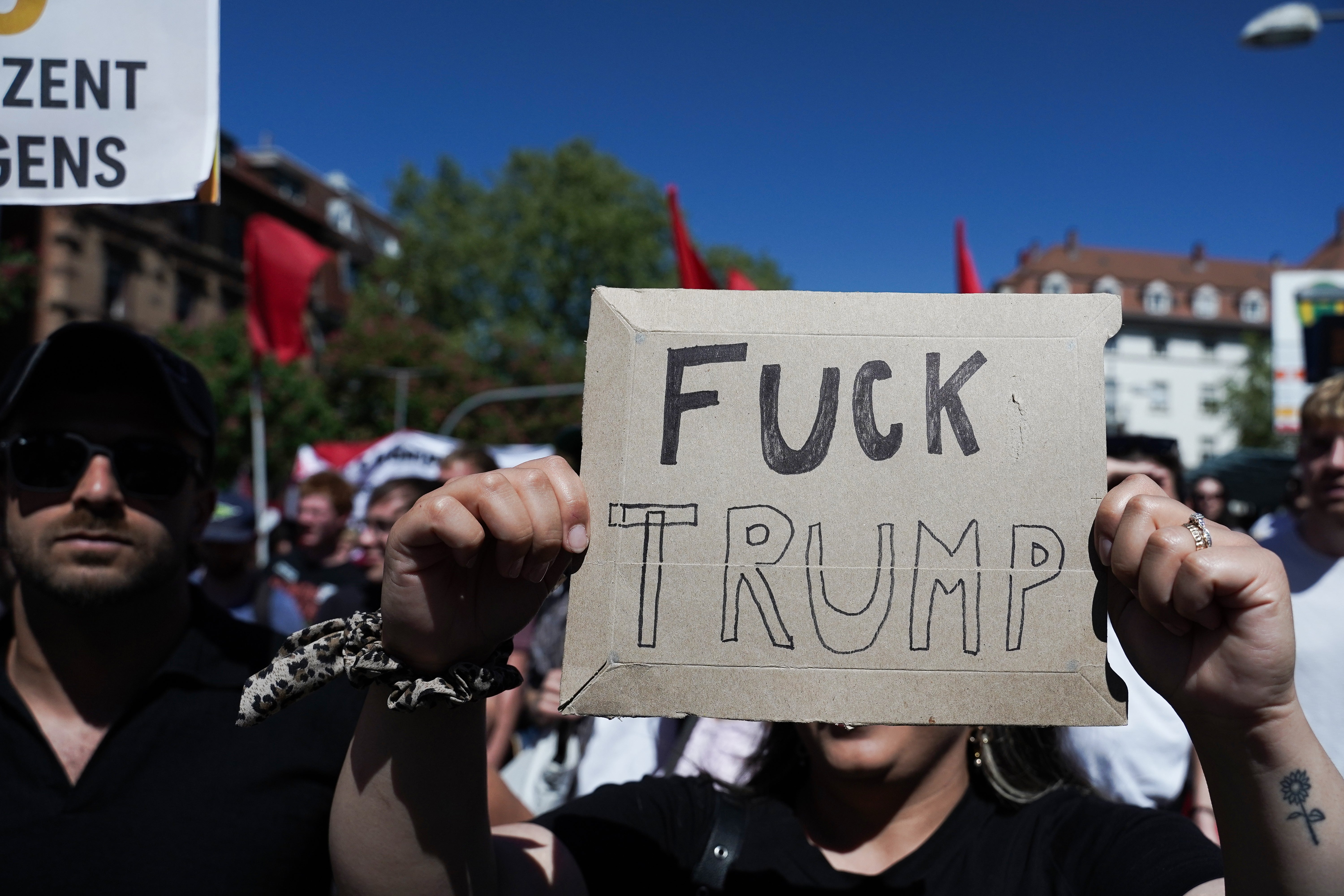 A idiosyncratic holds a motion with a governmental connection criticizing Trump during a protest