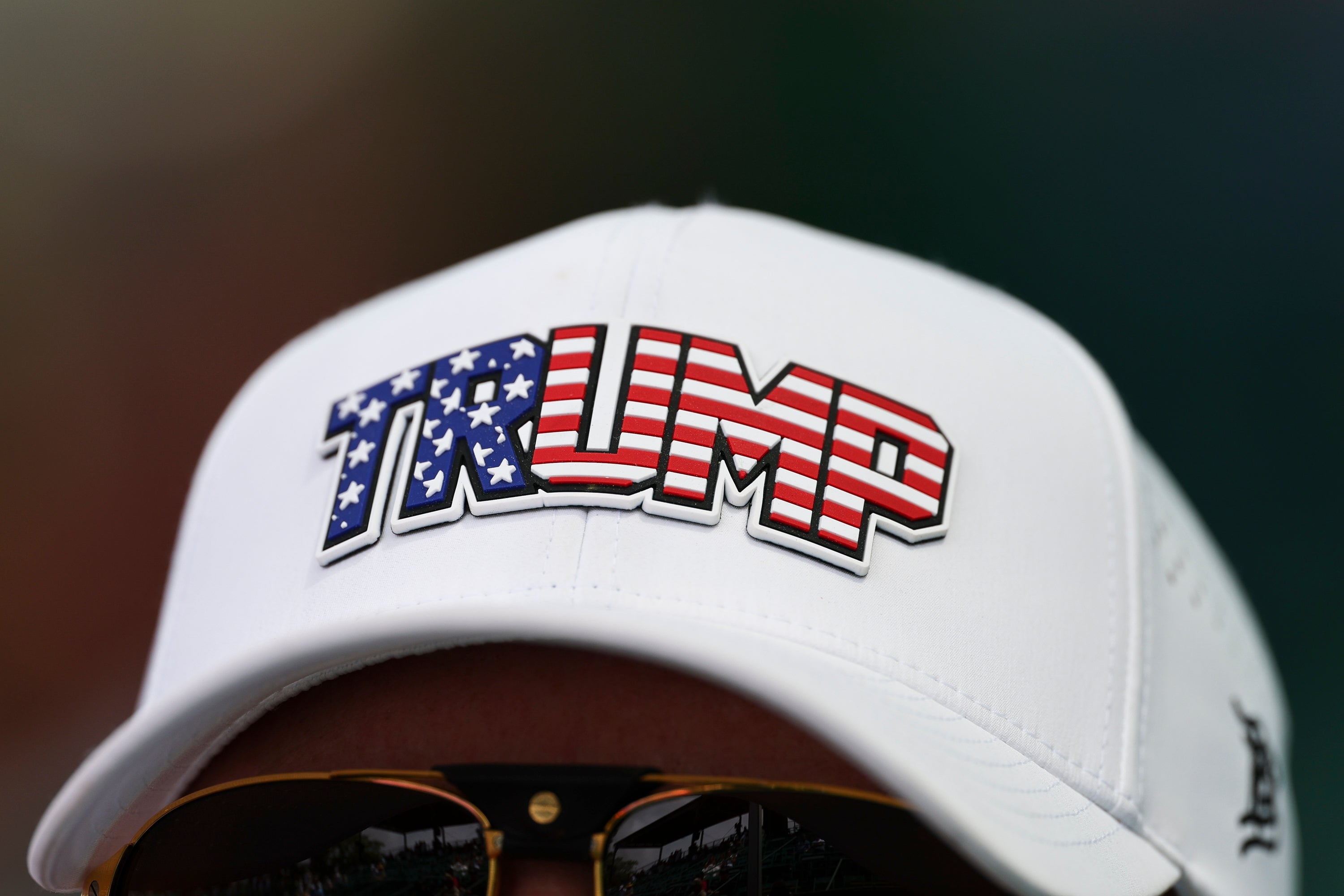 Baseball headdress with "TRUMP" substance styled successful an American emblem pattern