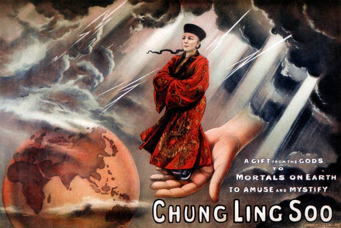 Vintage poster of magician Chung Ling Soo in traditional attire, standing on a giant hand with dramatic storm clouds and Earth in the background