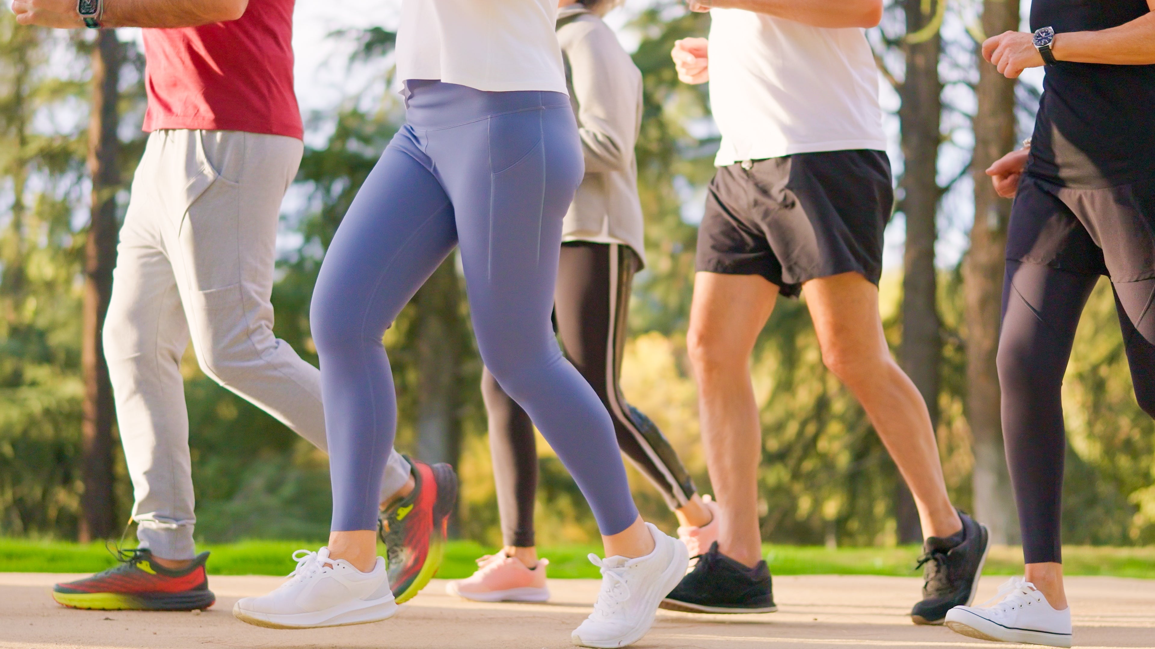 Group jogging outdoors for fittingness  and health, wearing diversion  covering  and sneakers