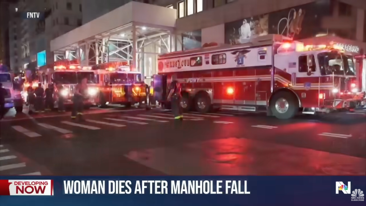 Several occurrence  trucks are connected  a metropolis  thoroughfare  astatine  nighttime  with their lights on; substance   mentions a pistillate   who died aft  a manhole fall