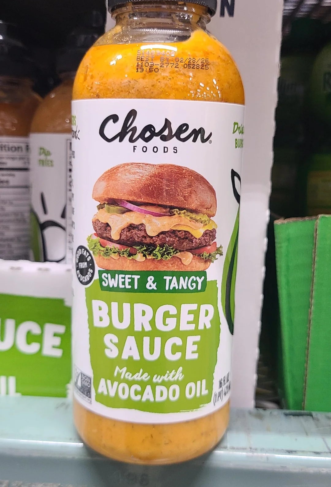 Chosen Foods burger sauce bottle with sweet and tangy flavor, made with avocado oil, displayed on a store shelf