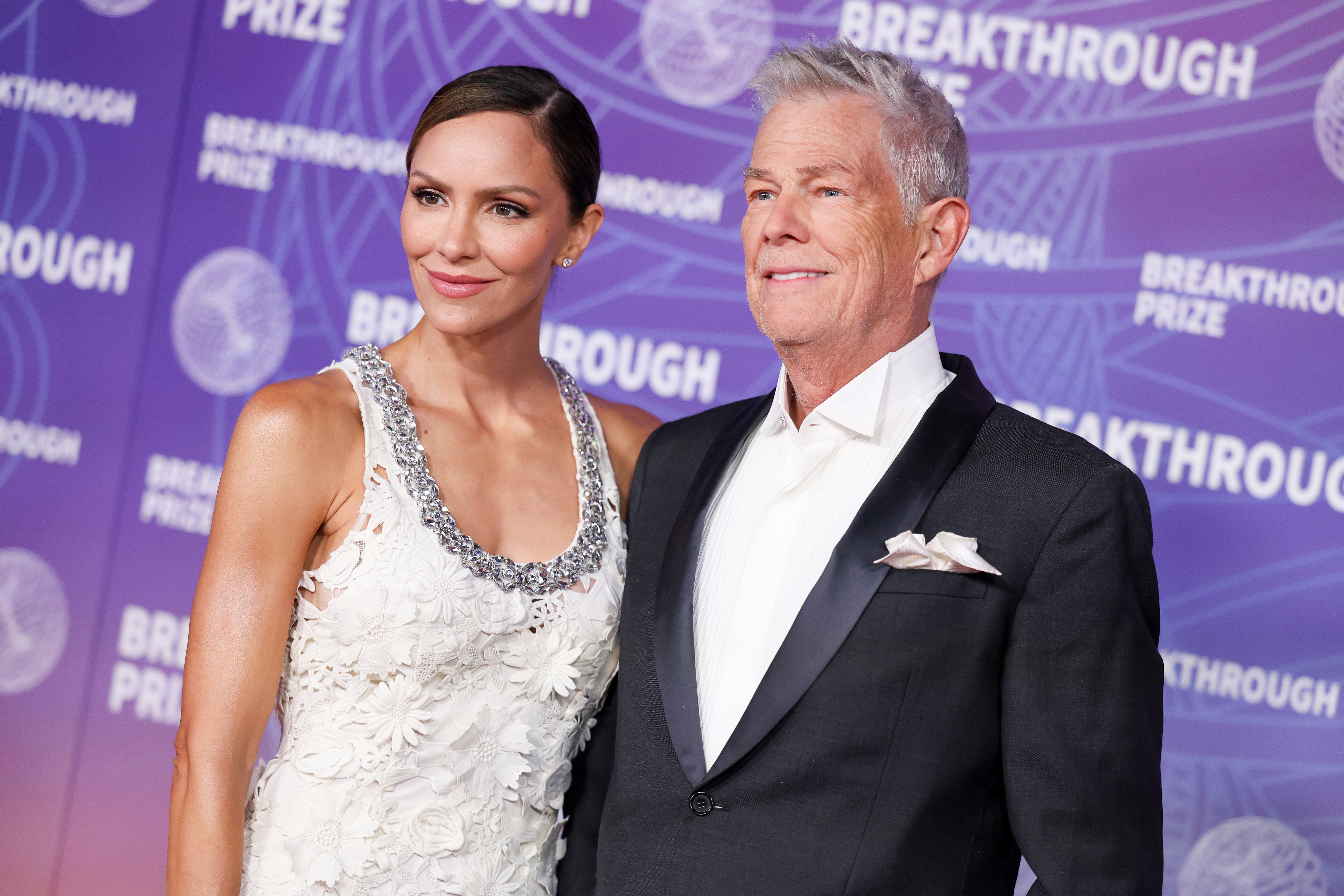 Two radical airs connected the Breakthrough Prize reddish carpet. One wears a elaborate sleeveless gown; the different is successful a tuxedo with a achromatic bow tie