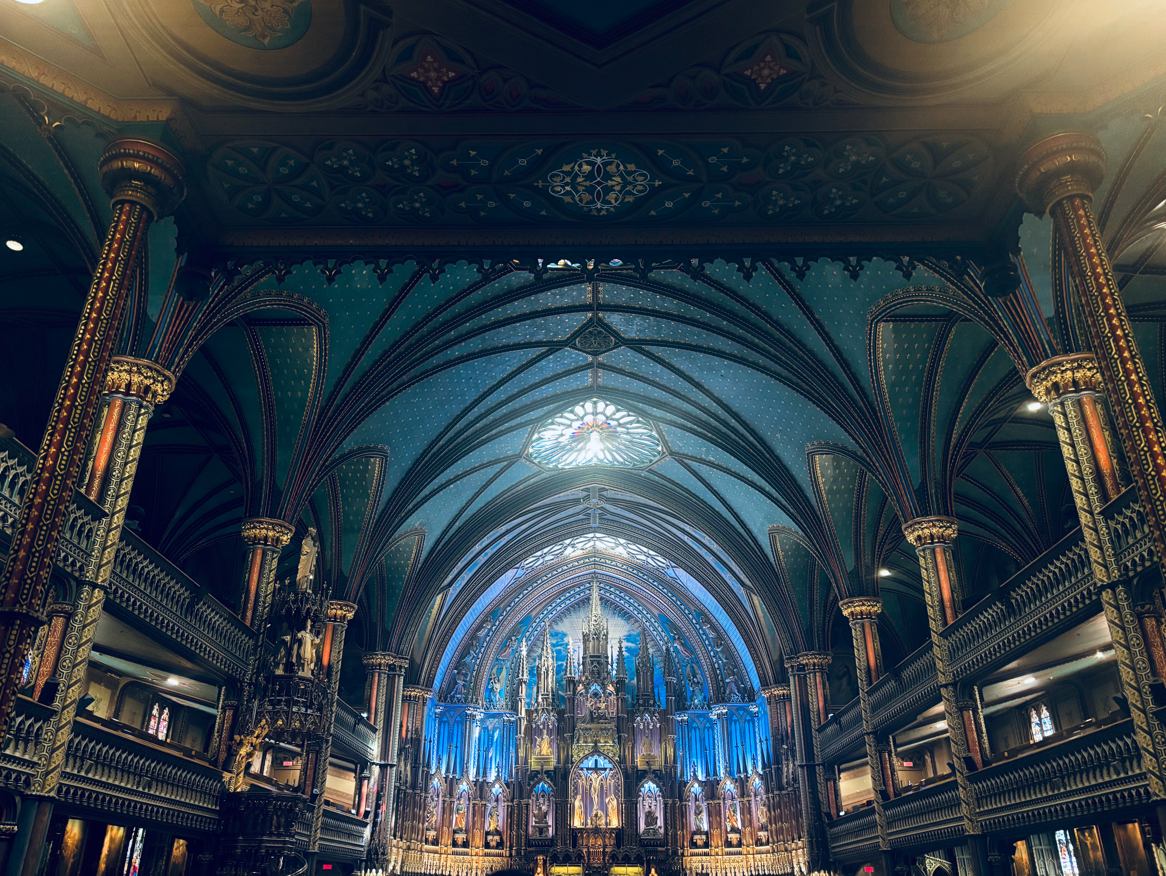 Ornate interior of a expansive  cathedral with intricate arches and a ample  illuminated altar successful  the center