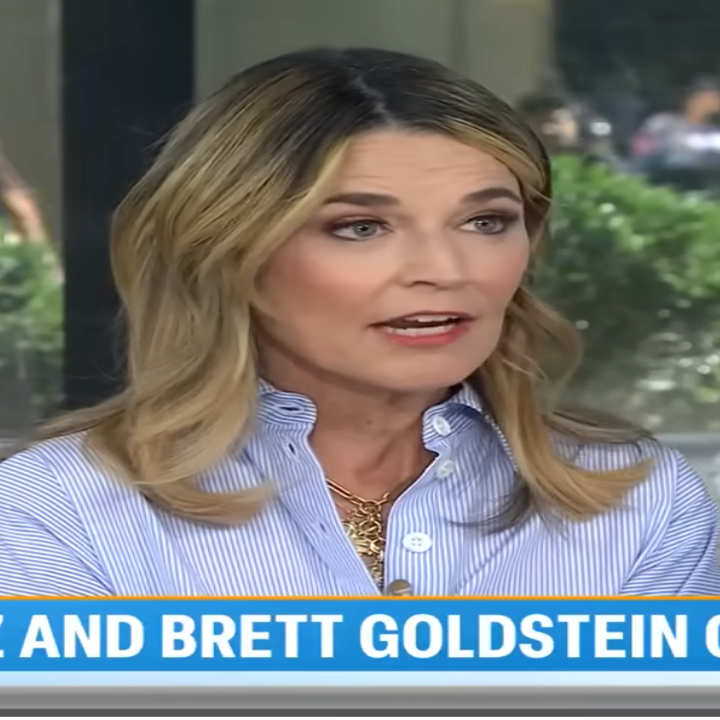 A news anchor in a studio discusses topics involving Jennifer Lopez and Brett Goldstein. The NBC logo is in the corner