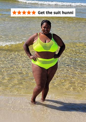 reviewer posing successful greenish suit with 5 prima review