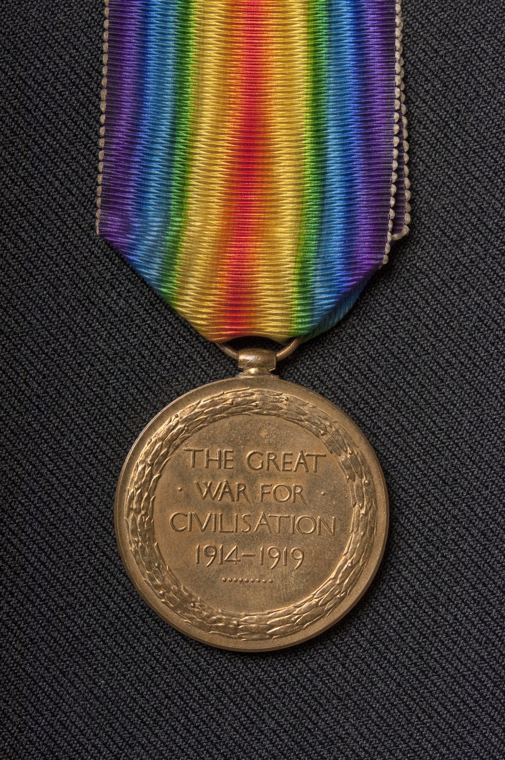World War I medal with rainbow-striped ribbon, inscribed with "The Great War for Civilisation 1914-1919."