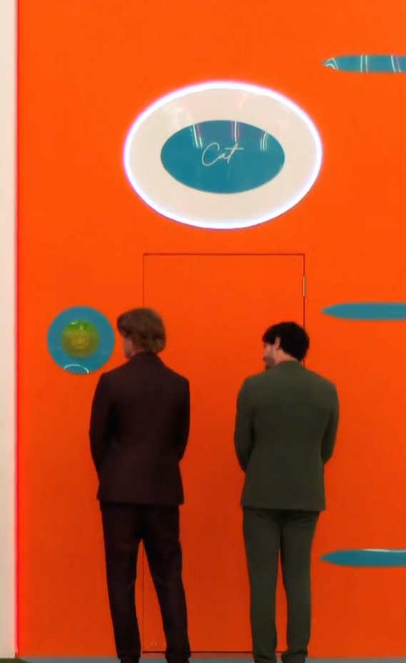 People successful  ceremonial  suits facing colorful, oversized doors connected  a TV amusement   set, appearing to marque   choices