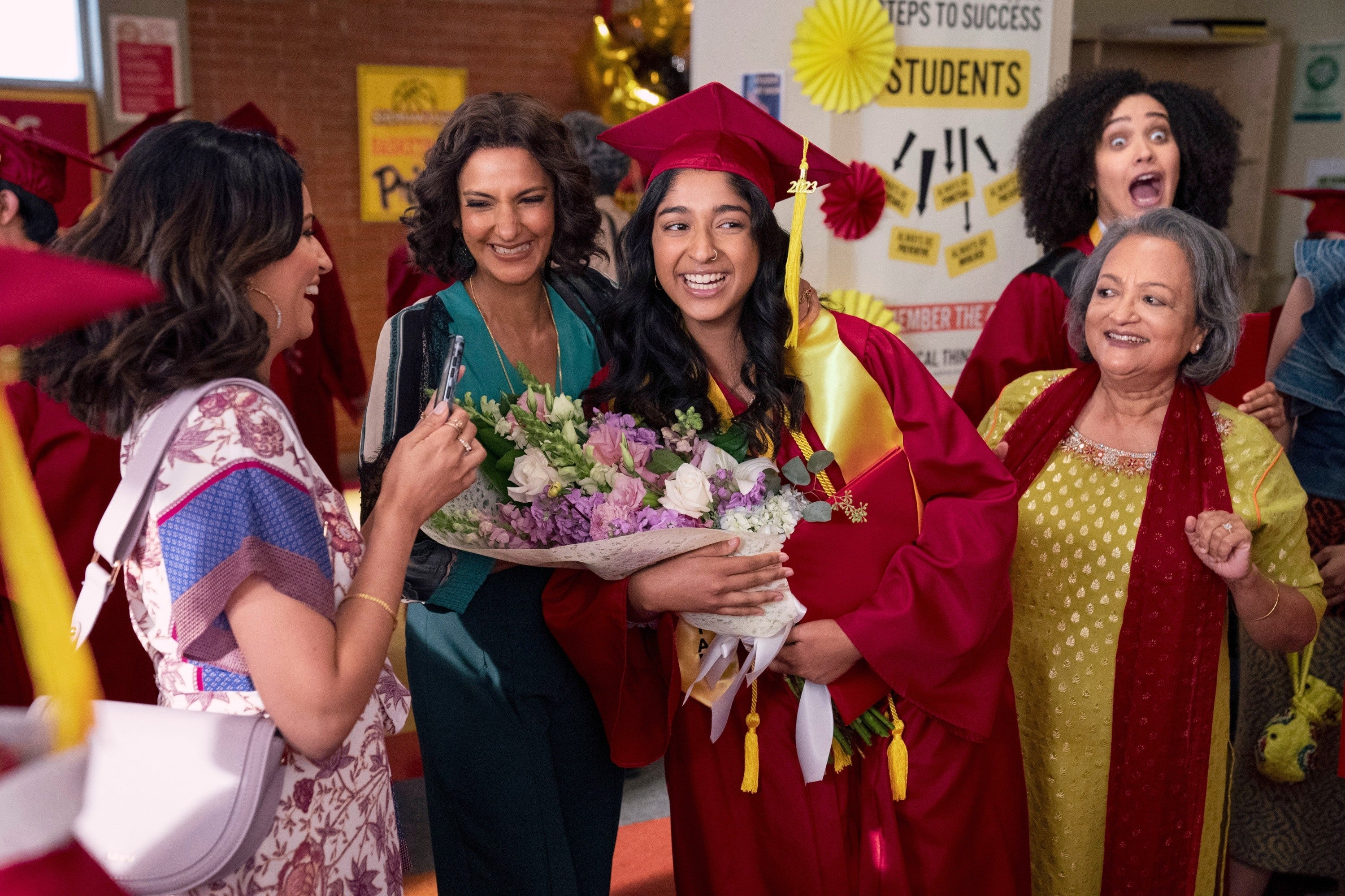 A joyous graduation scene with a smiling graduate in a cap and gown holding flowers, surrounded by proud, elegantly dressed family and friends