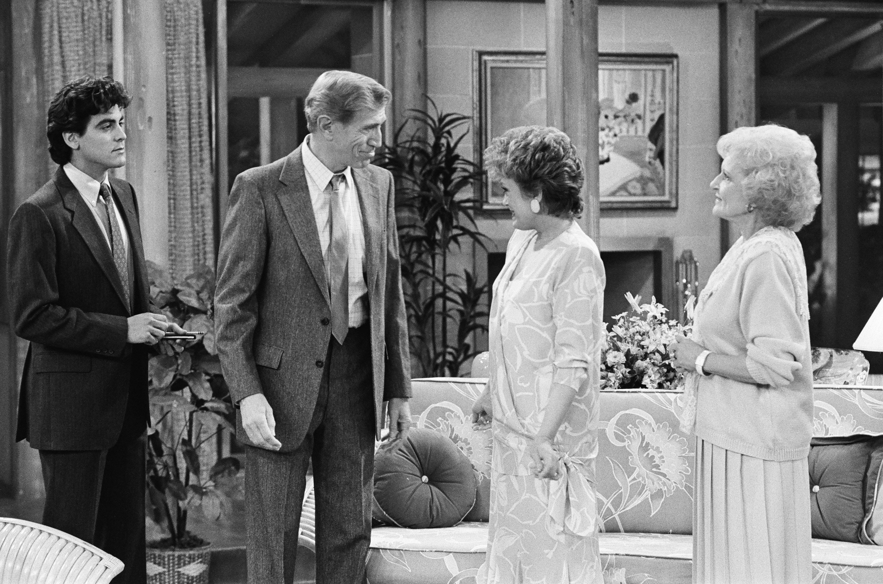 A country from a vintage TV amusement features 4 radical successful a surviving country setting, engaging successful conversation