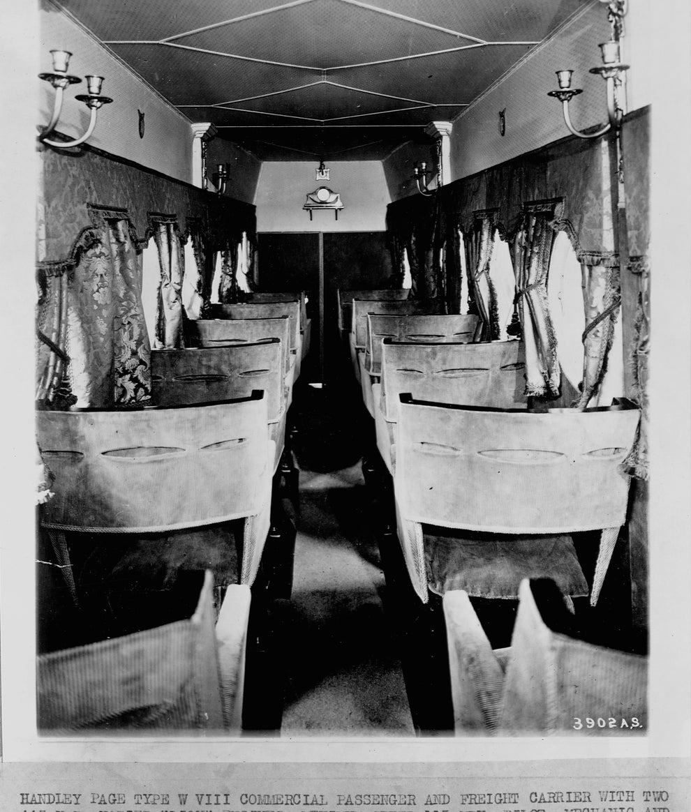 Vintage image of a Hadley Page Type W passenger aircraft interior with wooden seats from 1920