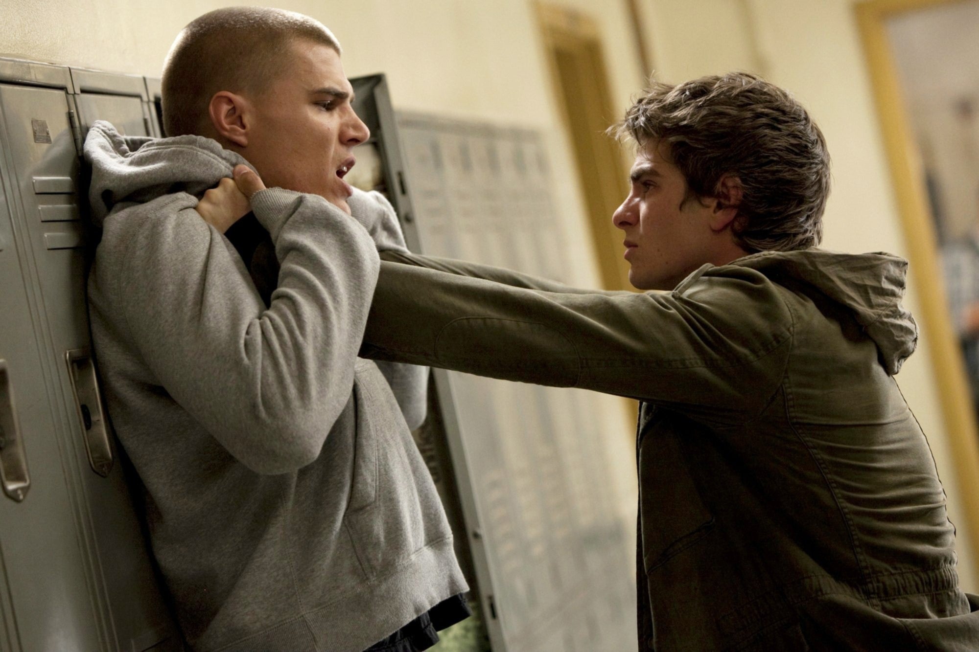 Two radical successful a tense confrontation successful a hallway, 1 holding the different against lockers. The country suggests struggle oregon aggression
