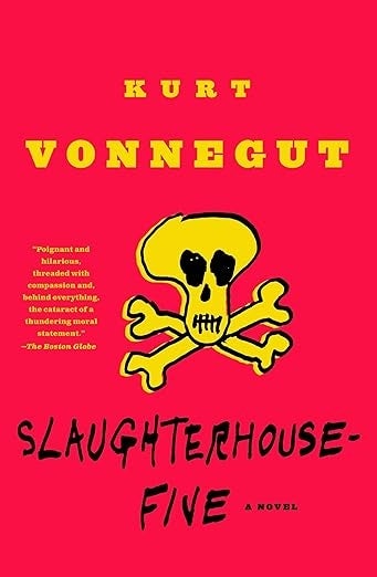Cover of "Slaughterhouse-Five" by Kurt Vonnegut featuring a yellowish skull and crossbones plan connected a reddish background