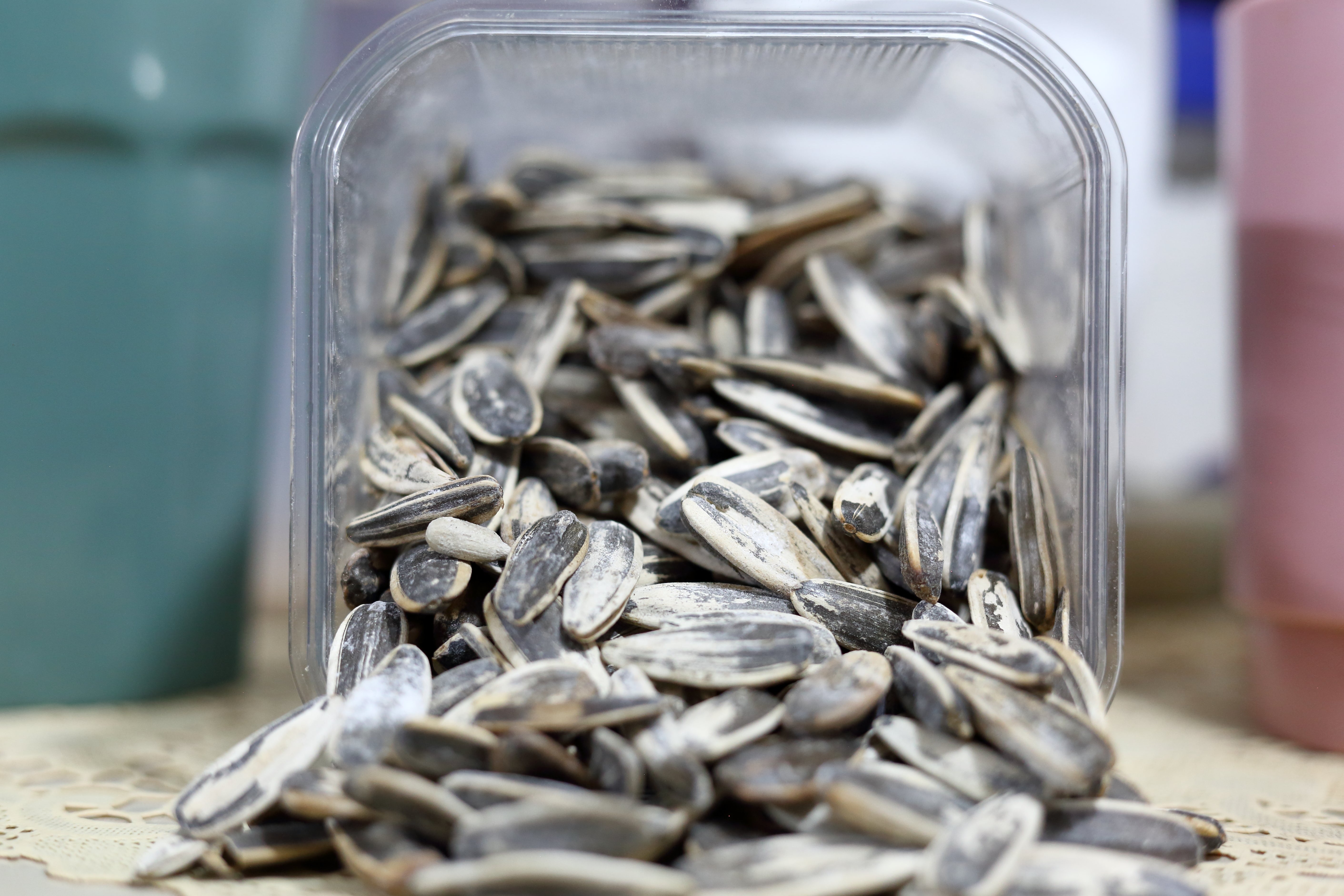 A instrumentality  of sunflower seeds spilling retired  connected  a table