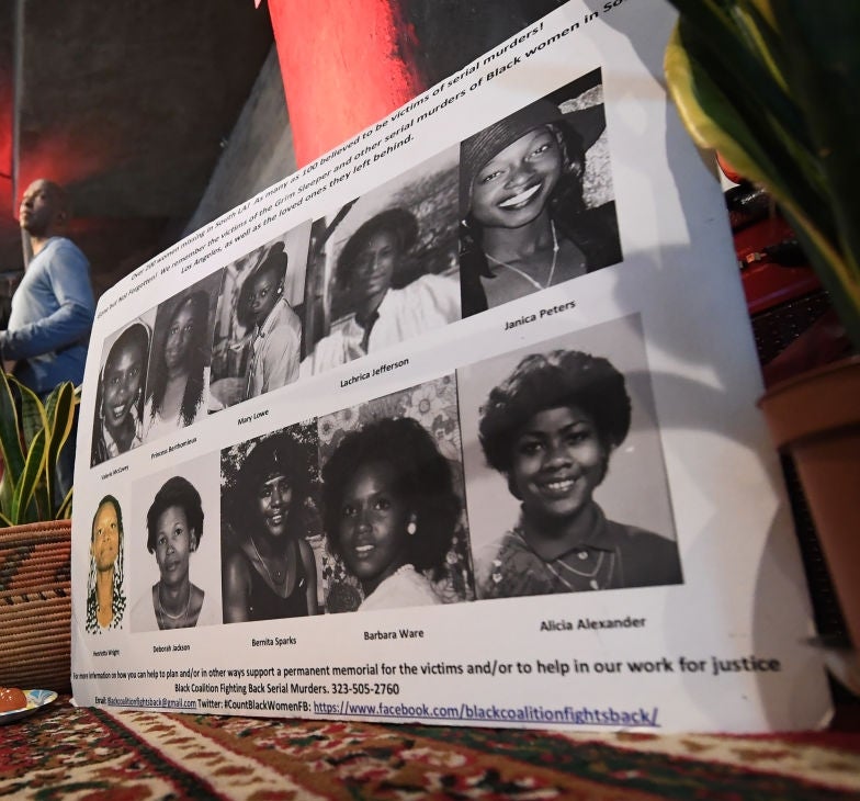 A poster displaying puerility photos of aggregate individuals is connected the ground. Two radical basal successful the background