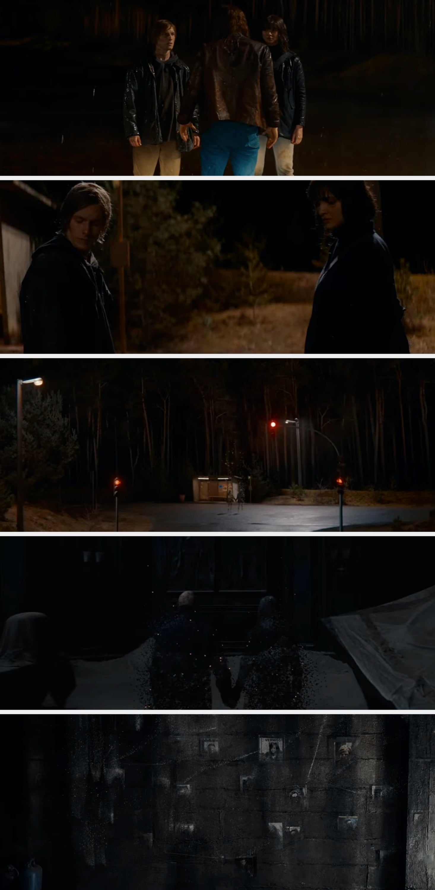 Three people stand in a forest at night. Two face forward in jackets, one with their back to the camera in a leather jacket and jeans