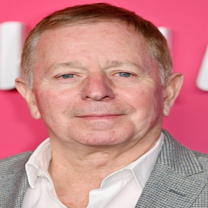 Martin Brundle in a suit jacket and shirt at a formal event