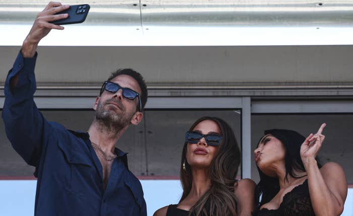 Simon Huck, Khloe Kardashian, and Kim Kardashian taking a selfie