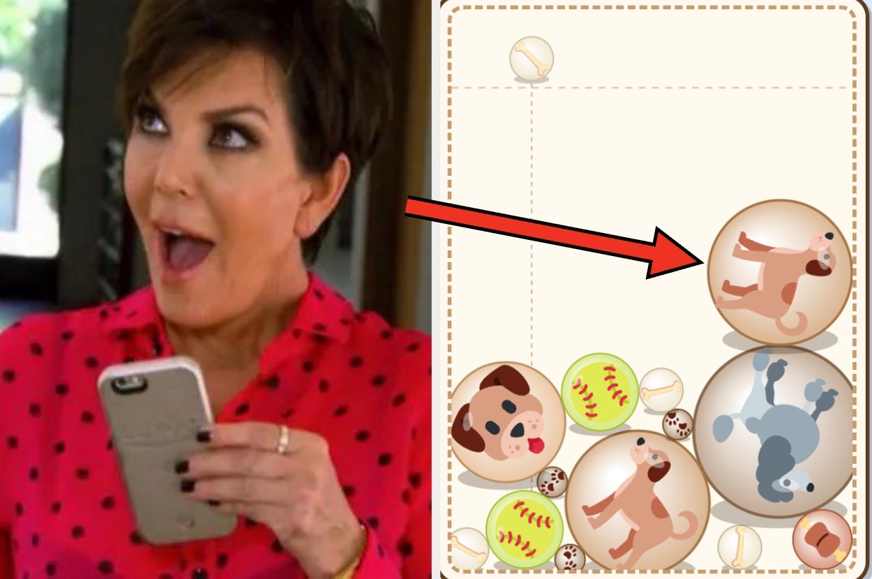 Person reacting excitedly to a mobile game screen featuring cartoon dogs and balls