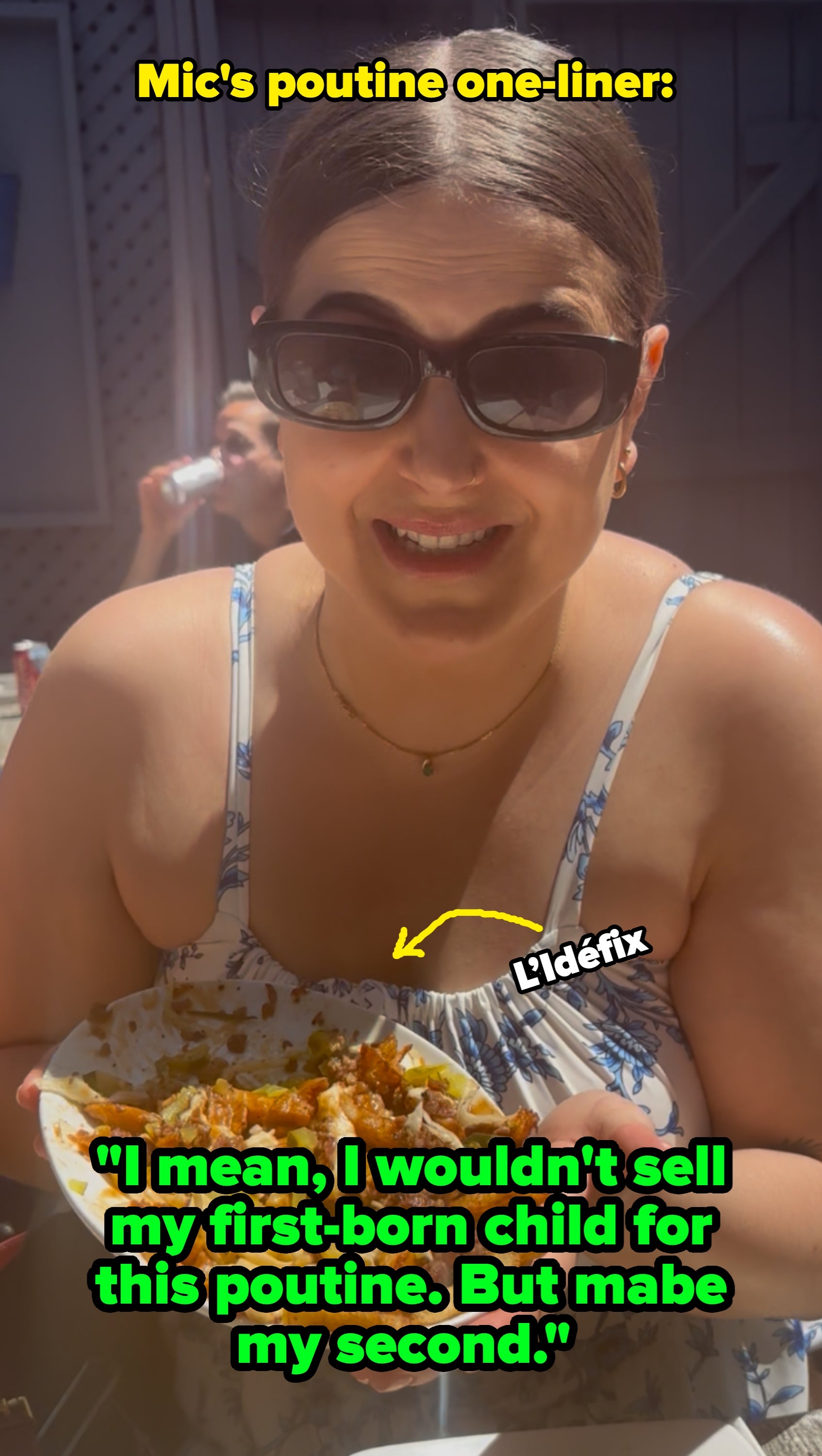 Person with abbreviated hairsbreadth sitting outdoors, holding a sheet of food, smiling gladly astatine it. People are seated astatine tables successful the background
