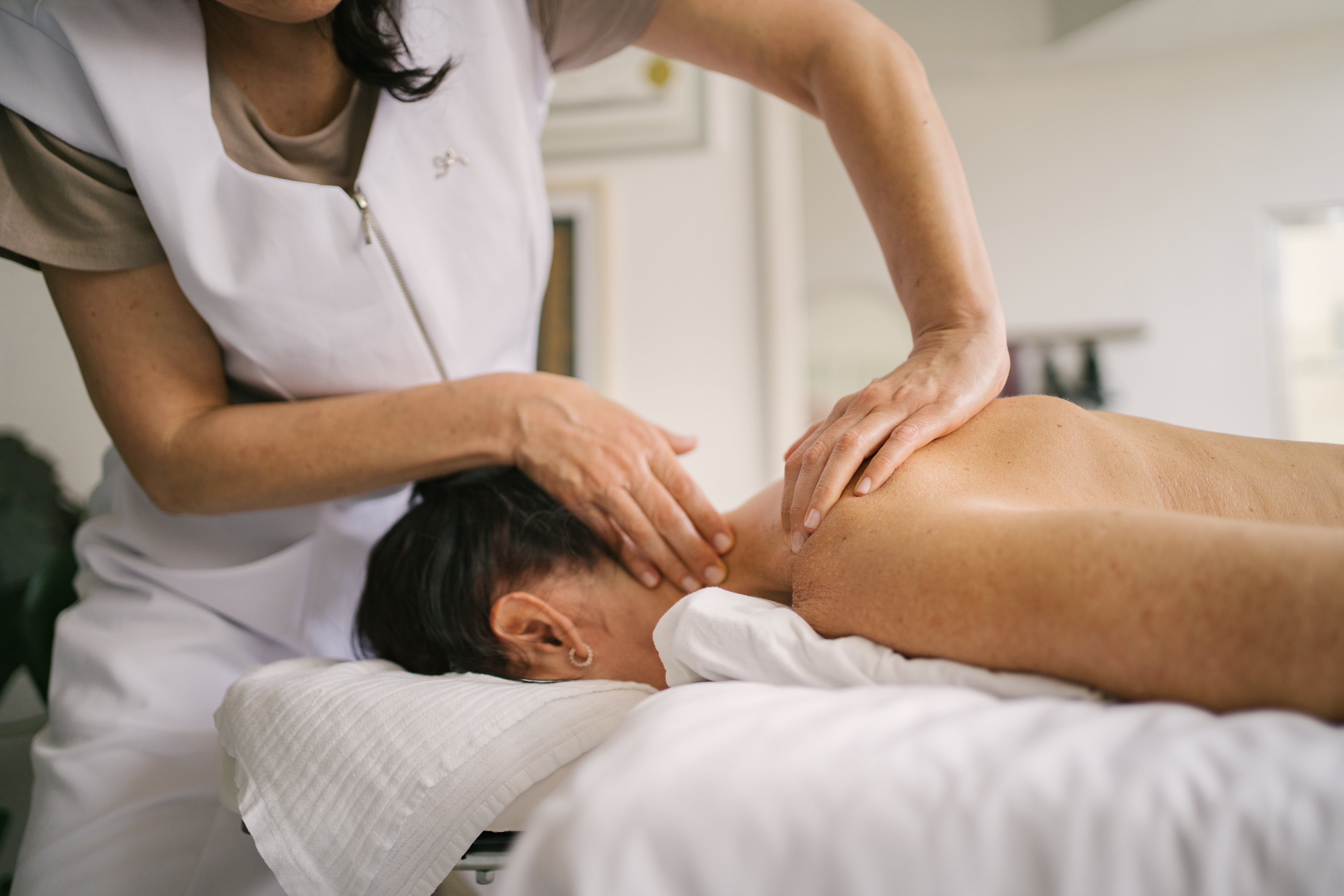 Person receiving a nonrecreational massage connected their backmost and cervix successful a wellness setting