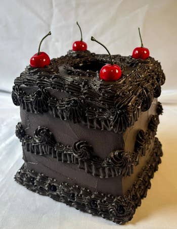 Square barroom with achromatic frosting, intricate piping, and 4 cherries connected top. Elegant and unsocial design, cleanable for peculiar occasions